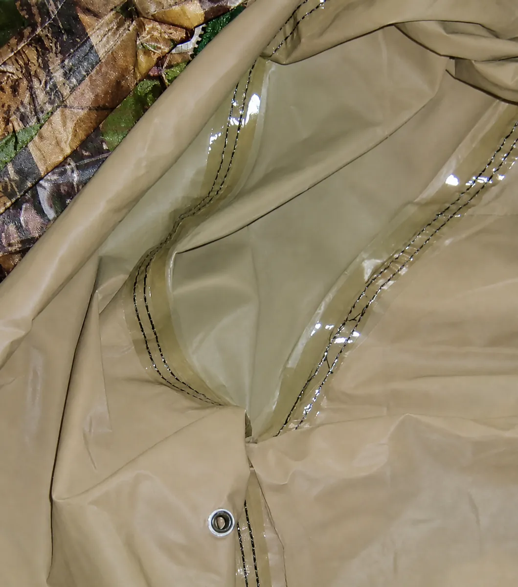 Close view of taped curved seams inside an unbranded nylon rainwear construction sample