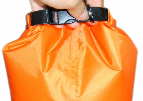 Source-preserving close view of hand, black buckle, webbing and gathered closed mouth