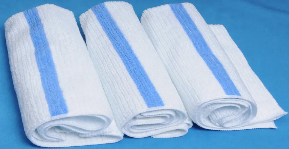 Four complete blue-and-white striped microfiber bath towels showing rolled and folded bulk formats