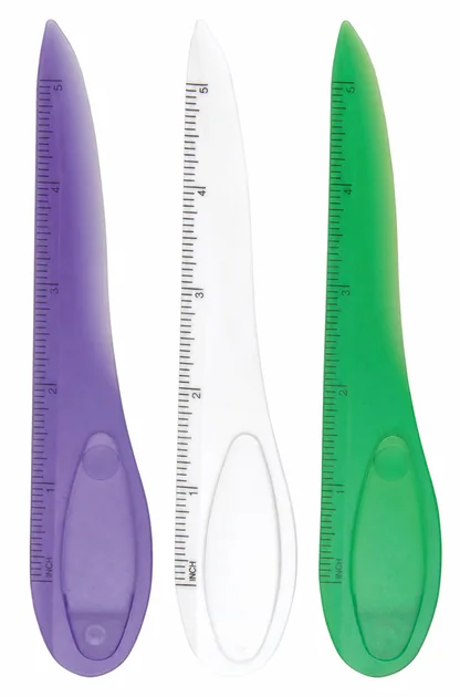 Three complete translucent ruler and guarded cutter tools in purple clear and green