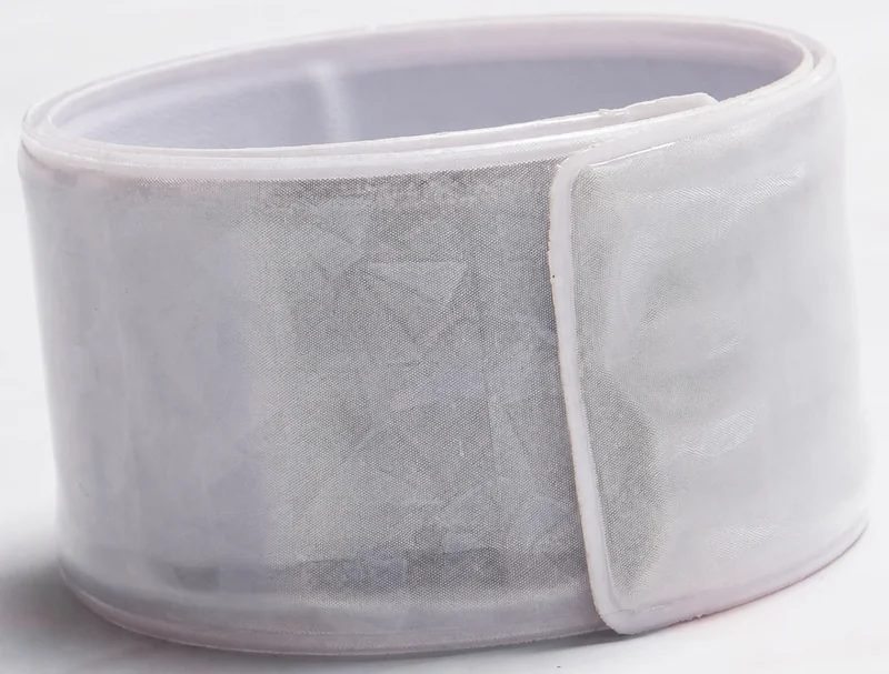 Complete silver reflective band with overlap end, edge seam and inner surface visible against a neutral background
