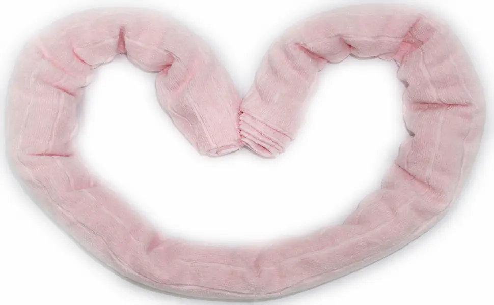 Complete pale pink ribbed towel arranged to show fold volume and surface continuity