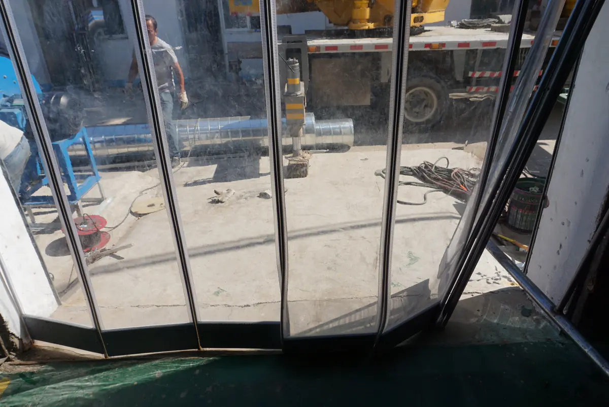 Mounted transparent magnetic doorway assembly showing the opening, panel field, center edges and lower finish.