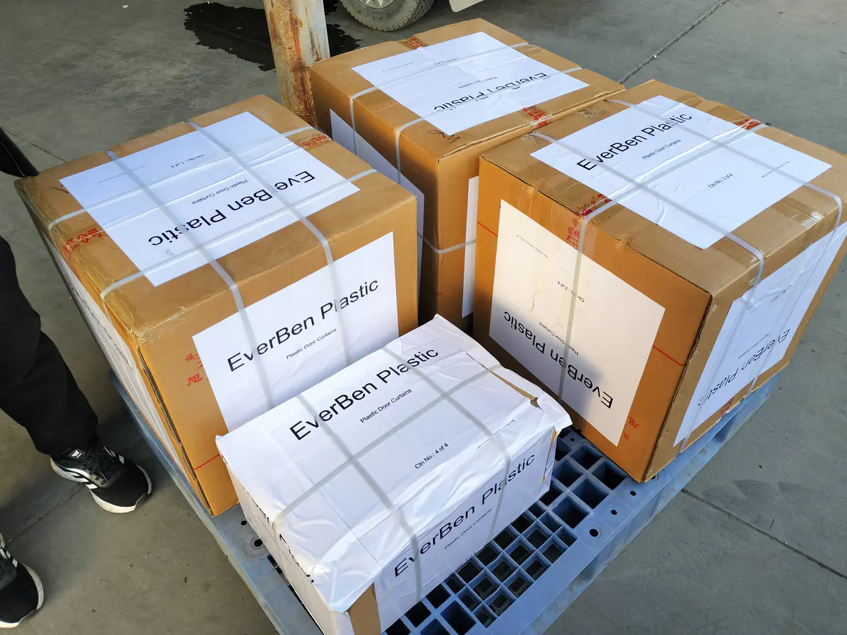 Grouped labeled door-curtain cartons prepared for kit identity and allocation review.