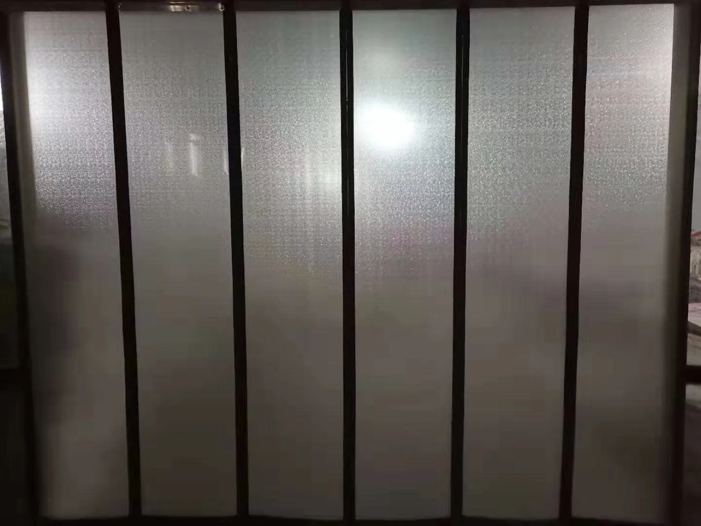 Complete flexible panel array with multiple dark edge carriers displayed against a dark review background.