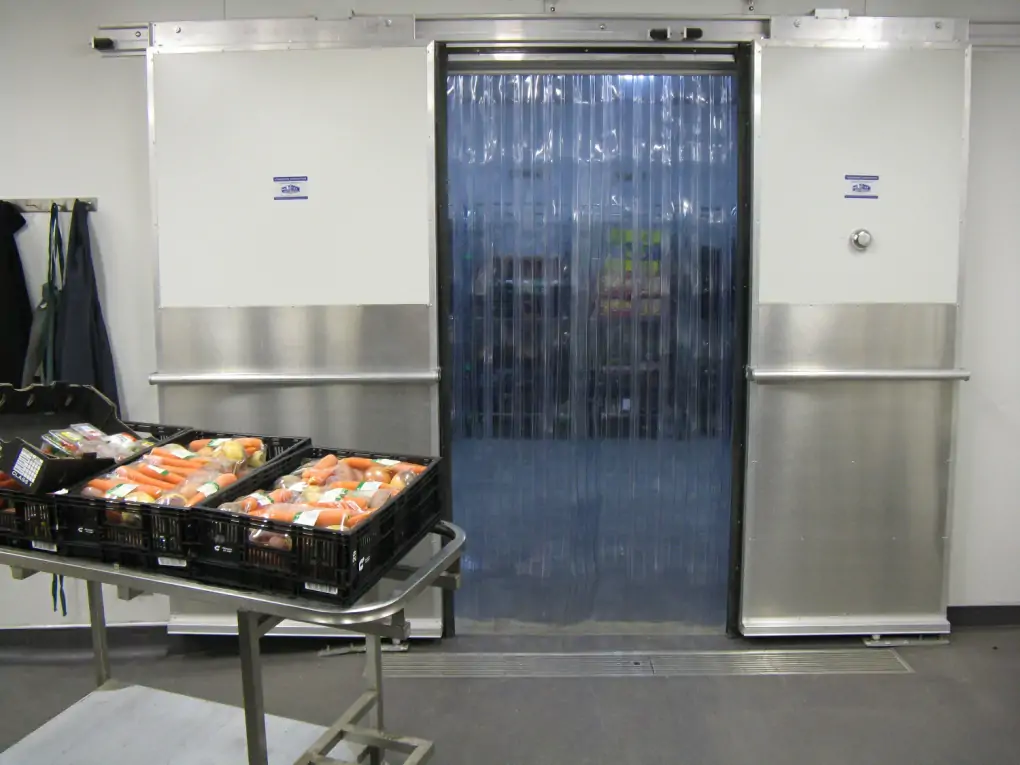 Commercial kitchen with PVC strip curtains for hygiene and temperature control