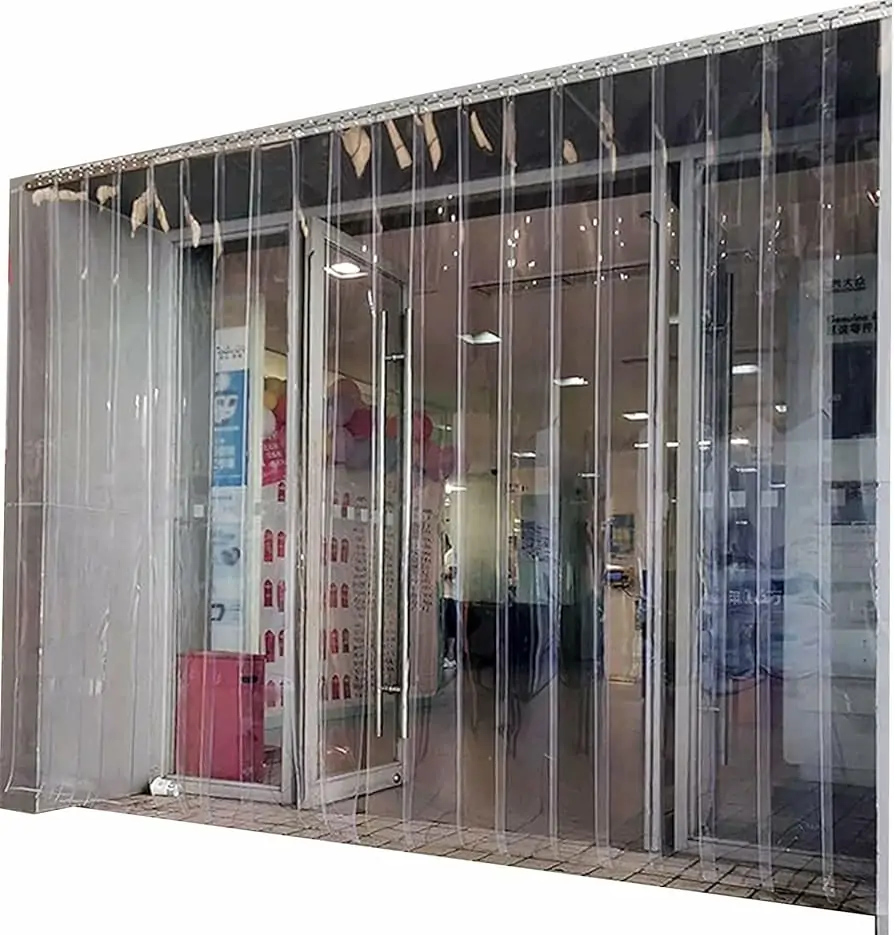 Transparent PVC strip curtain at commercial store entrance showing visibility and traffic flow