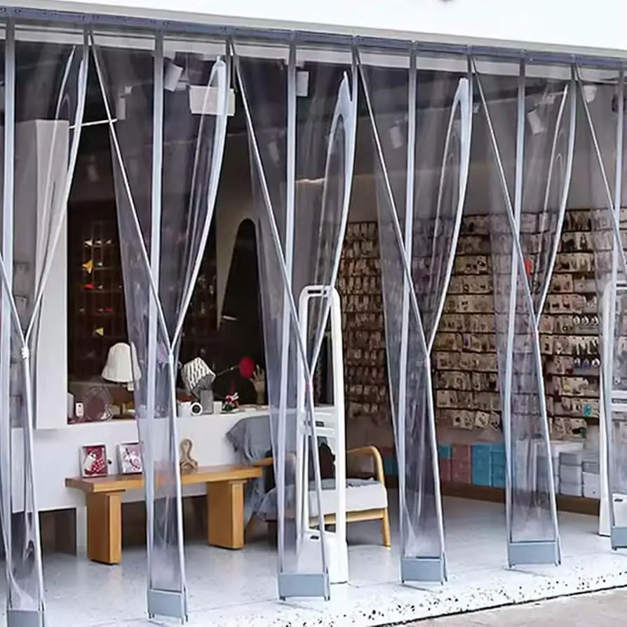 Retail store entrance with magnetic PVC door strips showing automatic closure and customer visibility